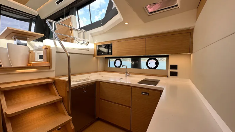 Kayenne Yacht Photos Pics Luxurious interior of 2023 Pardo Yachts GT 52 with modern kitchen design.