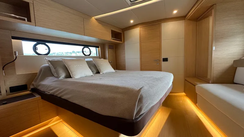 Kayenne Yacht Photos Pics Luxurious bedroom interior of 2023 Pardo Yachts GT 52 with modern design and ambient lighting.
