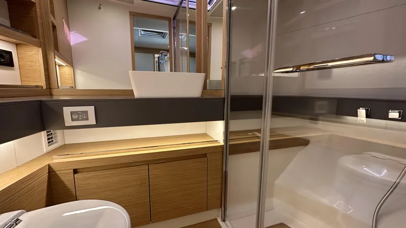 Kayenne Yacht Photos Pics Luxurious bathroom interior of 2023 Pardo Yachts GT 52 with modern fixtures and wood accents.