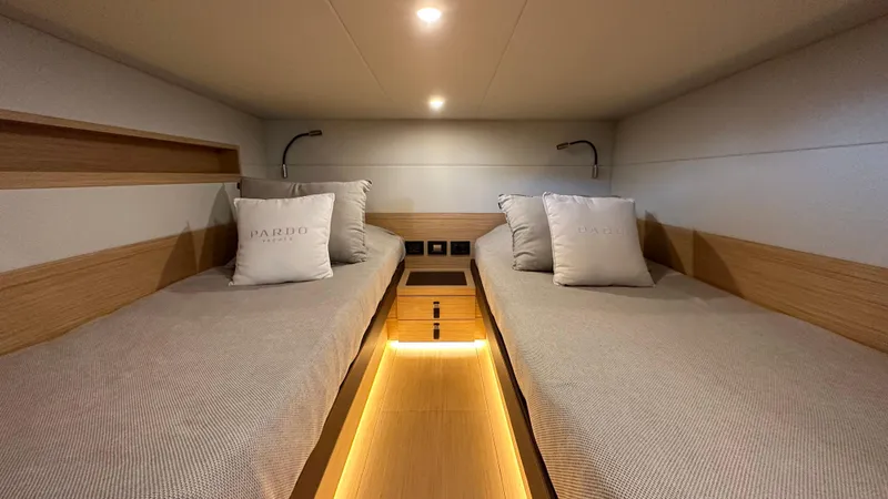 Kayenne Yacht Photos Pics 2023 Pardo Yachts GT 52 cabin with twin beds and modern lighting.