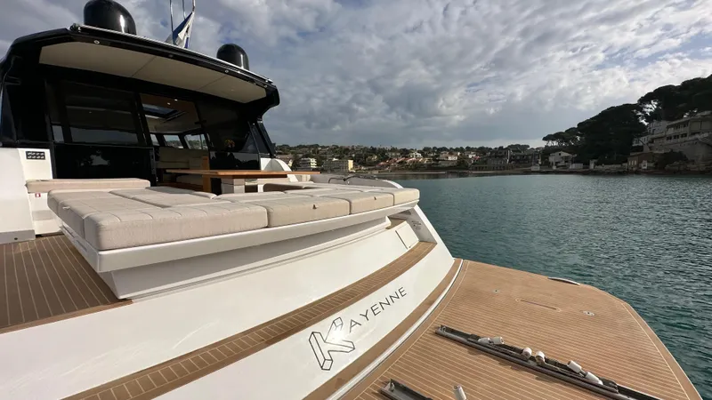 Kayenne Yacht Photos Pics Luxury 2023 Pardo Yachts GT 52 docked in scenic harbor.