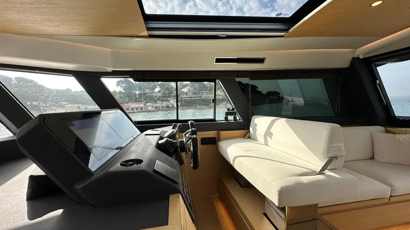 Kayenne Yacht Photos Pics Luxurious interior of 2023 Pardo Yachts GT 52 with modern helm and seating.