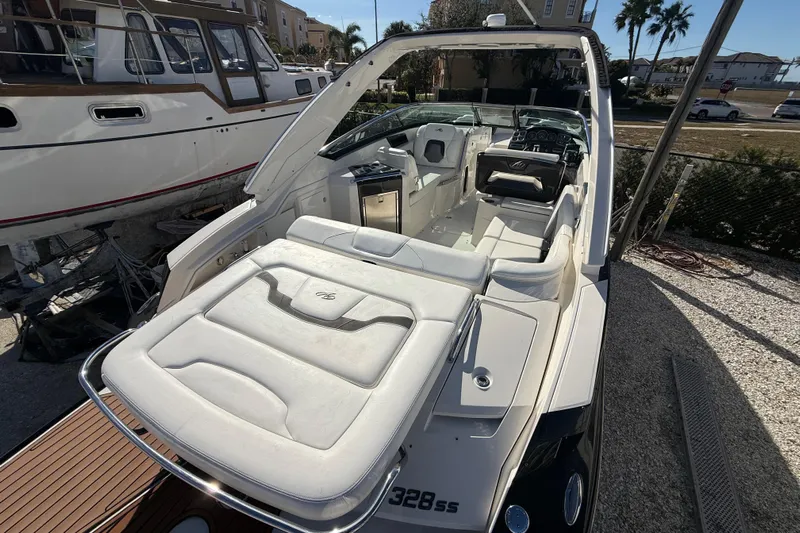  Yacht Photos Pics 2014 Monterey 328SS Super Sport boat with luxurious white interior and sleek design.