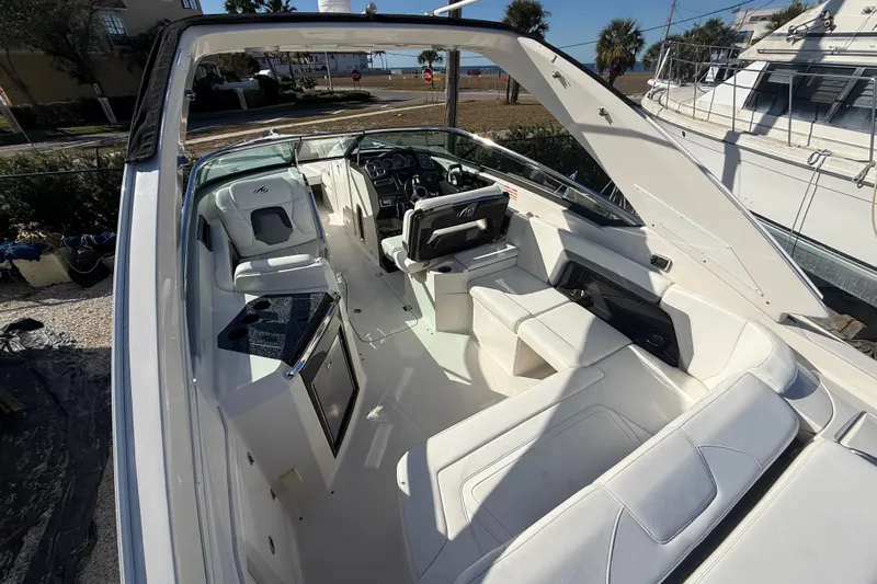  Yacht Photos Pics 2014 Monterey 328SS Super Sport boat interior with white seating and modern dashboard.
