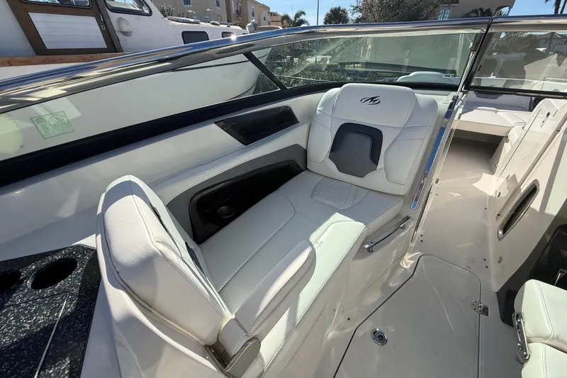  Yacht Photos Pics 2014 Monterey 328SS Super Sport boat interior with white leather seating and sleek design.
