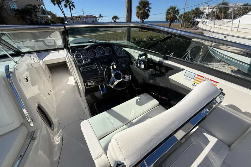  Yacht Photos Pics 2014 Monterey 328SS Super Sport boat interior with steering wheel and dashboard.