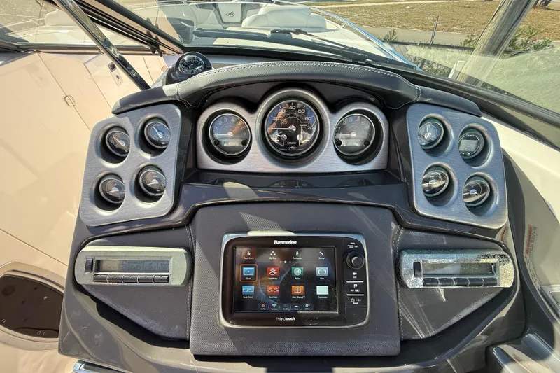  Yacht Photos Pics Dashboard of 2014 Monterey 328SS Super Sport boat with gauges and Raymarine display.