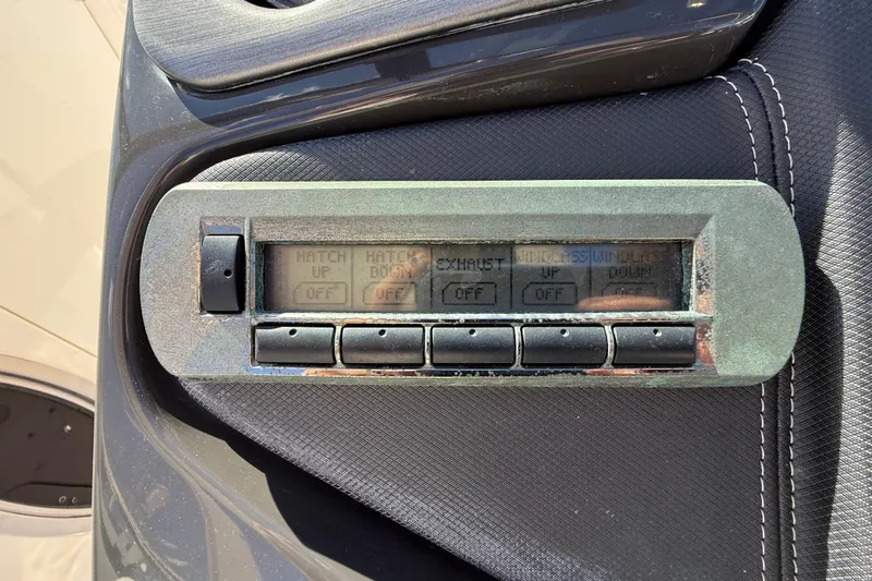  Yacht Photos Pics Control panel of a 2014 Monterey 328SS Super Sport boat with buttons and display.