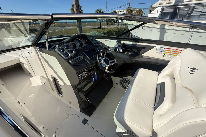  Yacht Photos Pics 2014 Monterey 328SS Super Sport boat interior with steering wheel and dashboard controls.