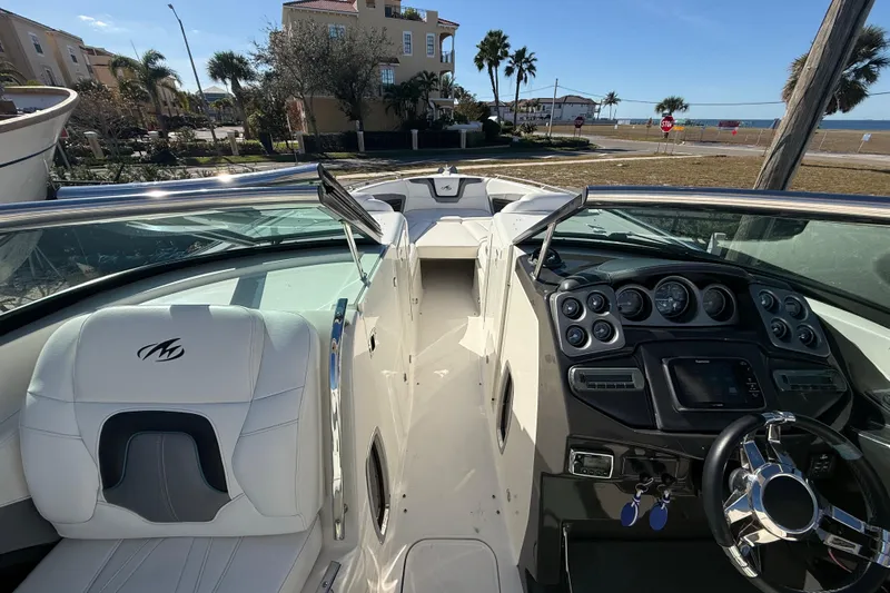  Yacht Photos Pics Interior of a 2014 Monterey 328SS Super Sport boat with dashboard and seating.