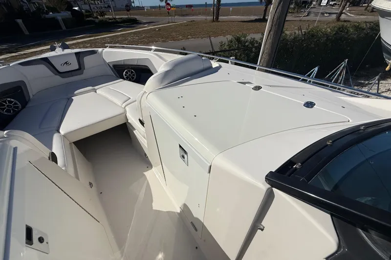  Yacht Photos Pics 2014 Monterey 328SS Super Sport boat interior with white seating and coastal view.