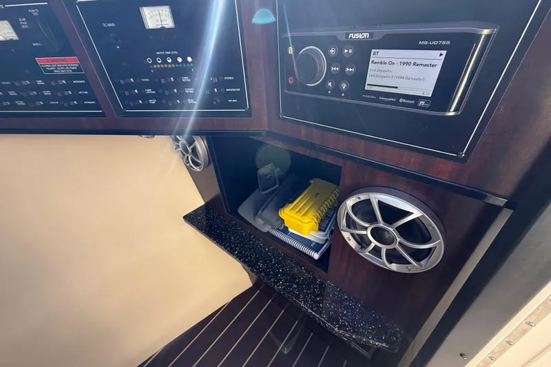  Yacht Photos Pics Control panel and audio system in 2014 Monterey 328SS Super Sport boat interior.