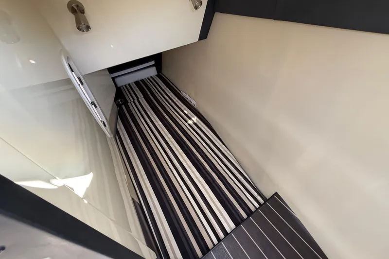  Yacht Photos Pics 2014 Monterey 328SS Super Sport cabin interior with striped flooring and sleek design.