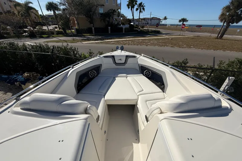  Yacht Photos Pics 2014 Monterey 328SS Super Sport boat with spacious white seating and coastal view.