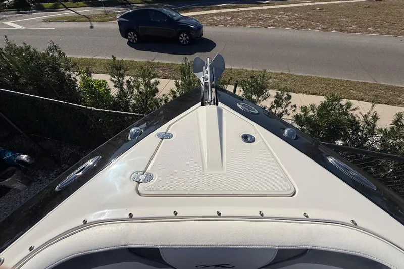  Yacht Photos Pics 2014 Monterey 328SS Super Sport boat bow with anchor, parked near road.