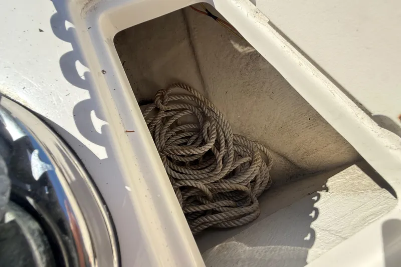  Yacht Photos Pics Coiled rope in storage compartment of 2014 Monterey 328SS Super Sport boat.