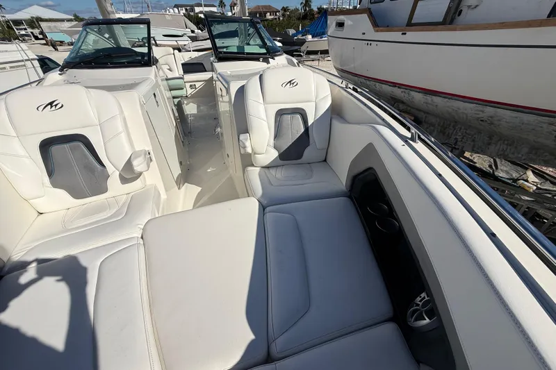  Yacht Photos Pics 2014 Monterey 328SS Super Sport boat interior with white seating and cup holders.