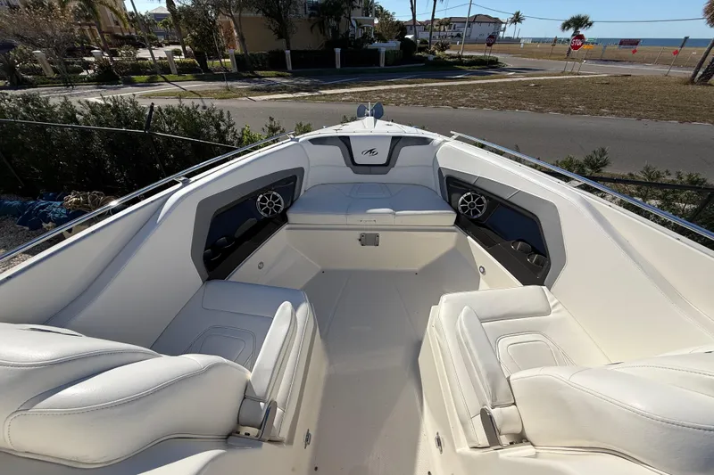  Yacht Photos Pics 2014 Monterey 328SS Super Sport boat interior with white seating and coastal view.