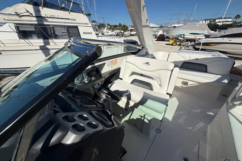  Yacht Photos Pics 2014 Monterey 328SS Super Sport boat interior with steering wheel and seating.
