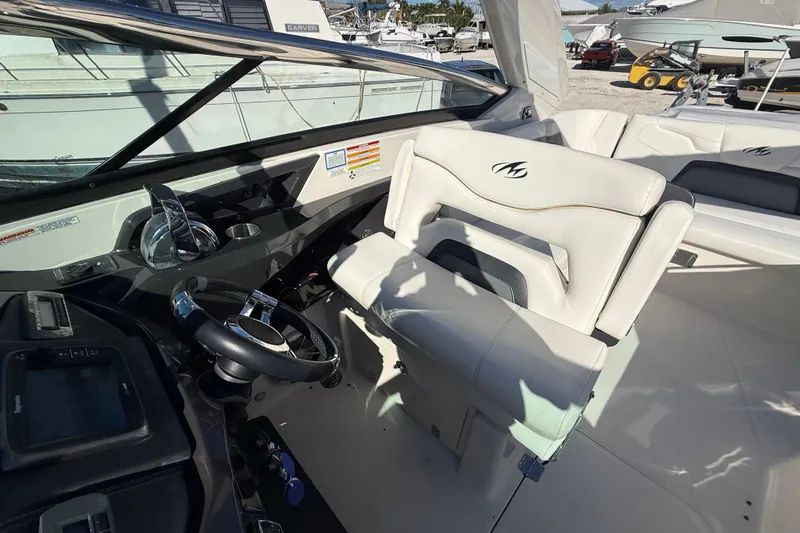  Yacht Photos Pics Interior of 2014 Monterey 328SS Super Sport boat with steering wheel and seating.