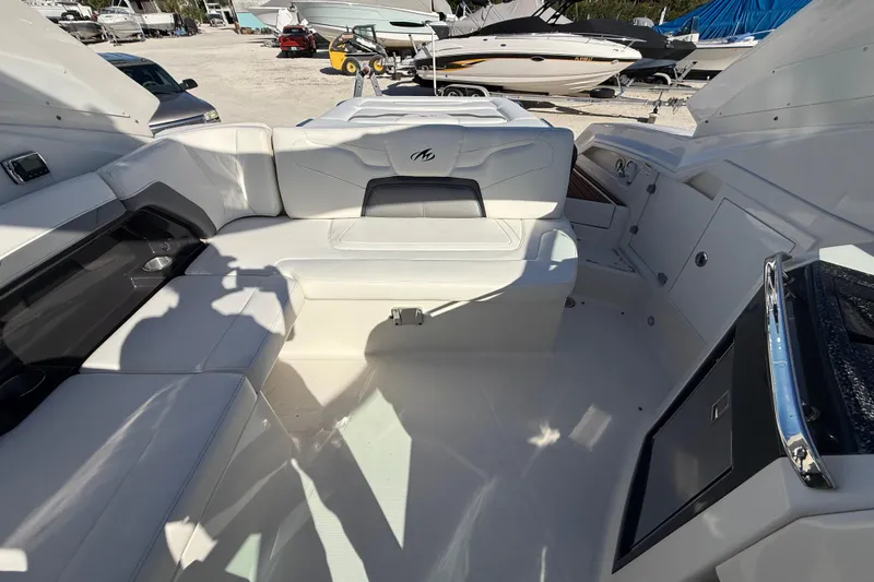  Yacht Photos Pics Interior of a 2014 Monterey 328SS Super Sport boat with white seating and modern design.