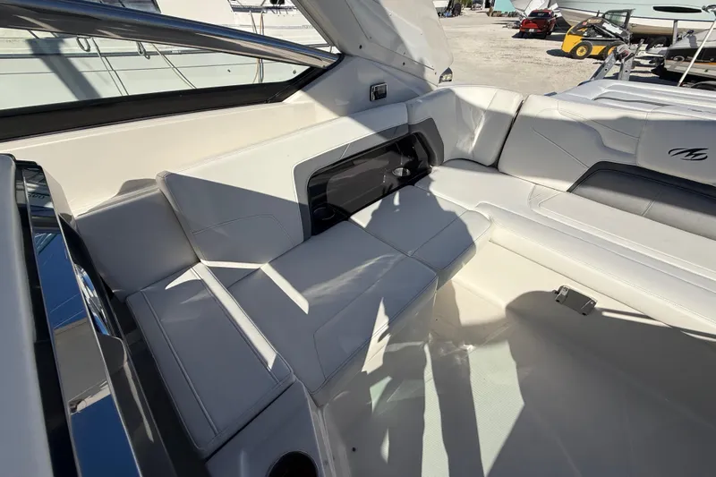  Yacht Photos Pics Luxurious interior of a 2014 Monterey 328SS Super Sport boat with white seating.