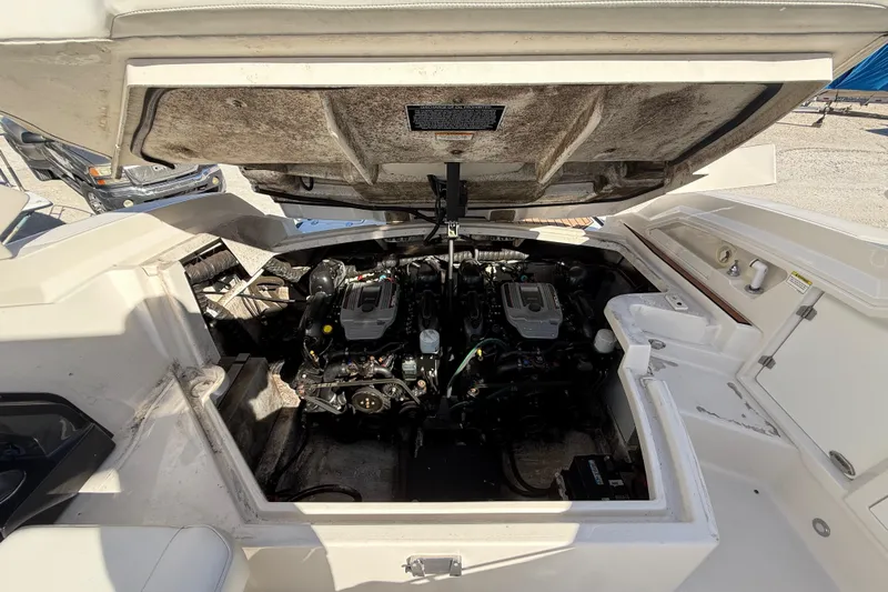  Yacht Photos Pics Open engine compartment of 2014 Monterey 328SS Super Sport boat, showcasing dual engines.