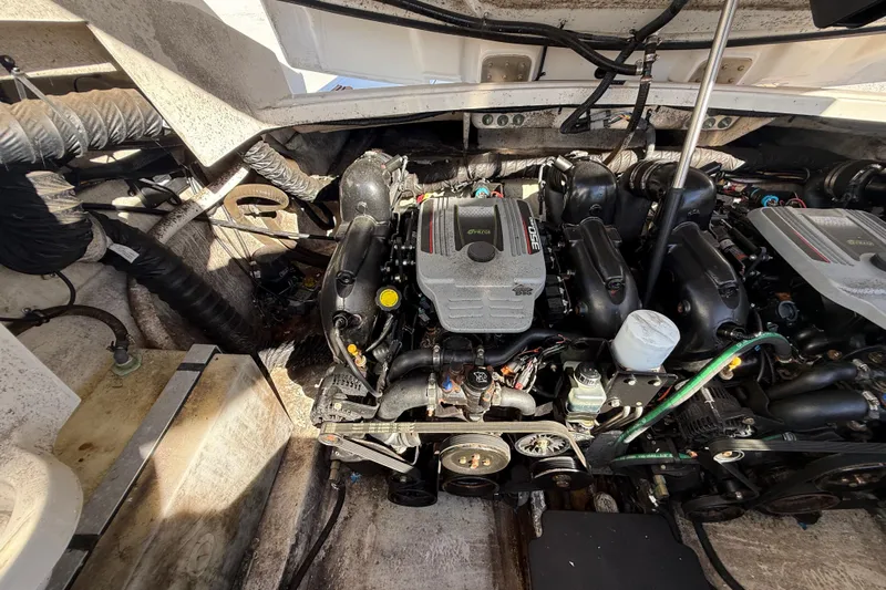  Yacht Photos Pics Engine compartment of a 2014 Monterey 328SS Super Sport boat, showcasing detailed mechanical components.