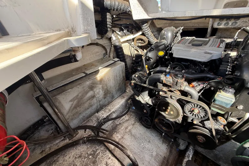  Yacht Photos Pics Engine compartment of a 2014 Monterey 328SS Super Sport boat, showcasing mechanical components.