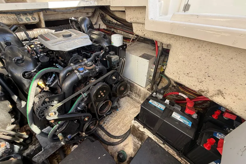  Yacht Photos Pics Engine compartment of a 2014 Monterey 328SS Super Sport boat, showing engine and batteries.
