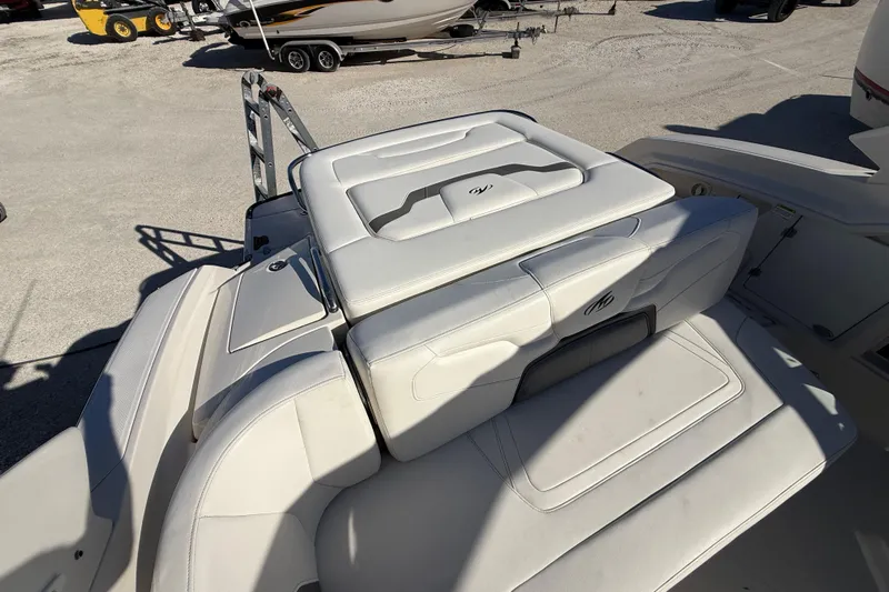  Yacht Photos Pics 2014 Monterey 328SS Super Sport boat with white leather seating in a sunny outdoor setting.