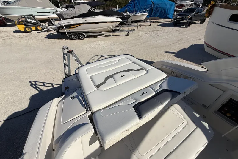  Yacht Photos Pics 2014 Monterey 328SS Super Sport boat interior with cushioned seating in a marina setting.