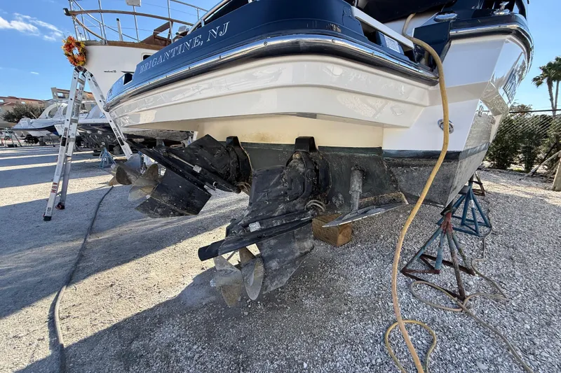 Yacht Photos Pics 2014 Monterey 328SS Super Sport boat on dry dock, showing dual propellers and hull.