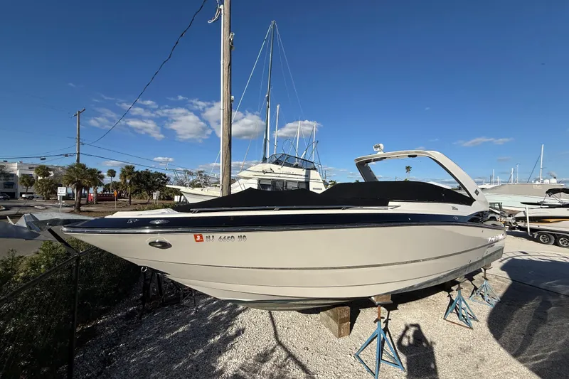  Yacht Photos Pics 2014 Monterey 328SS Super Sport boat on stands under clear blue sky.