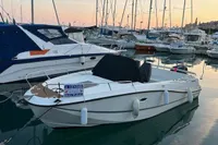 2020 Quicksilver Activ 755 Sundeck boat docked in marina at sunset.