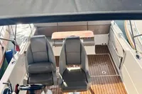 2020 Quicksilver Activ 755 Sundeck with canopy, docked at marina, featuring dual seats.