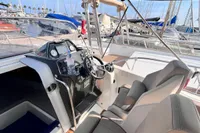 Quicksilver Activ 755 Sundeck 2020 boat interior with helm, docked at marina.
