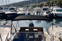 2020 Quicksilver Activ 755 Sundeck moored in a marina with other boats.
