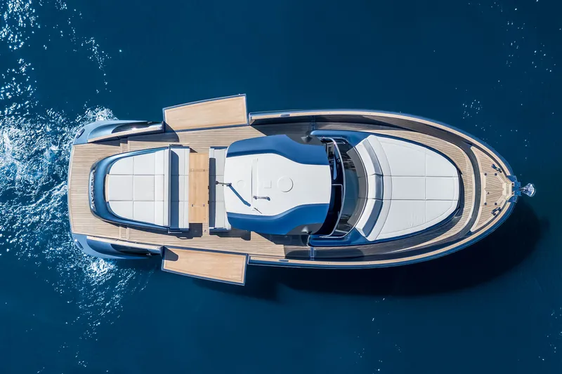 Salt Escape Yacht Photos Pics 2021 Solaris Power 48 OPEN yacht, aerial view, cruising on blue ocean waters.