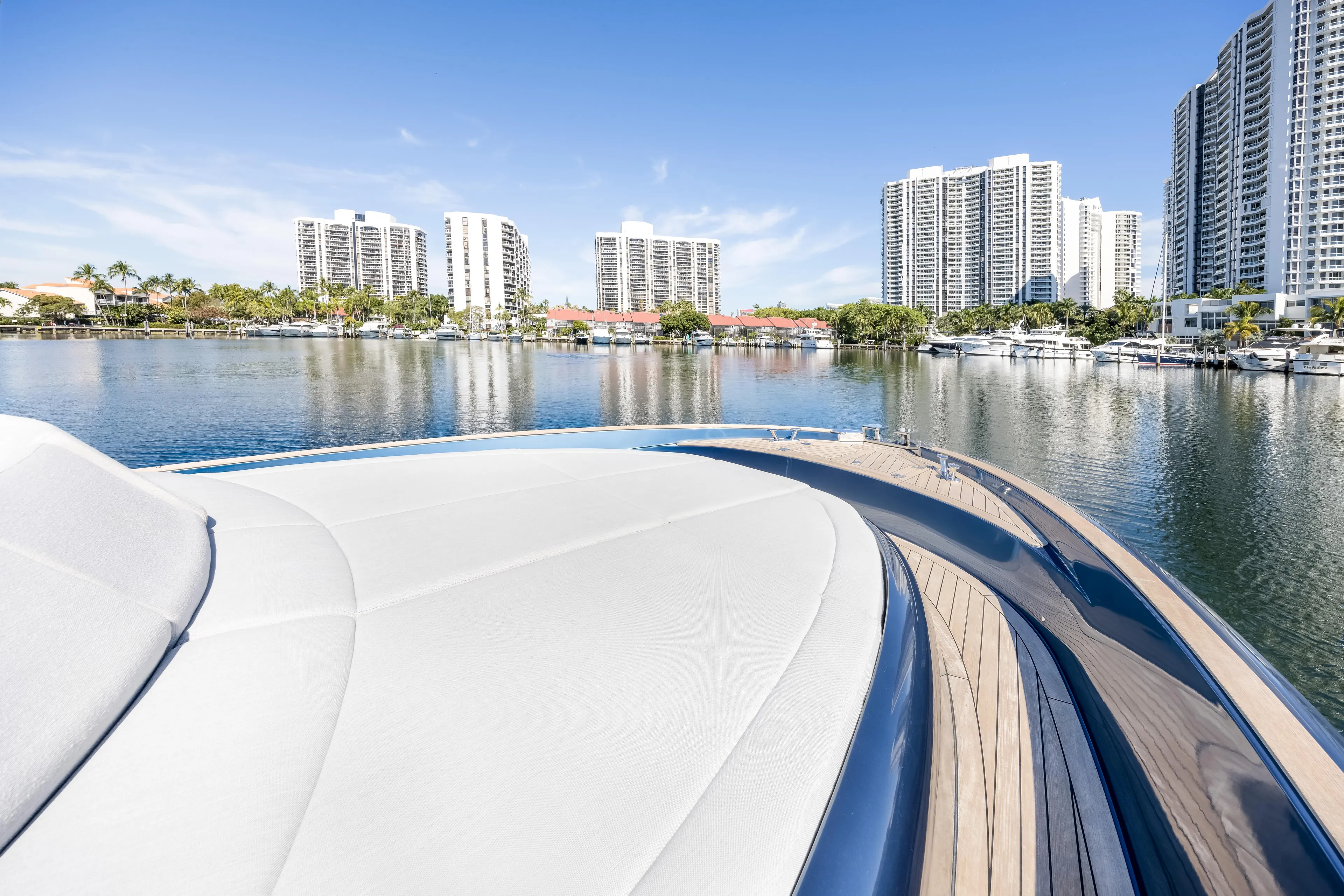 Salt Escape Yacht Photos Pics 2021 Solaris Power 48 OPEN yacht on water with city skyline backdrop.