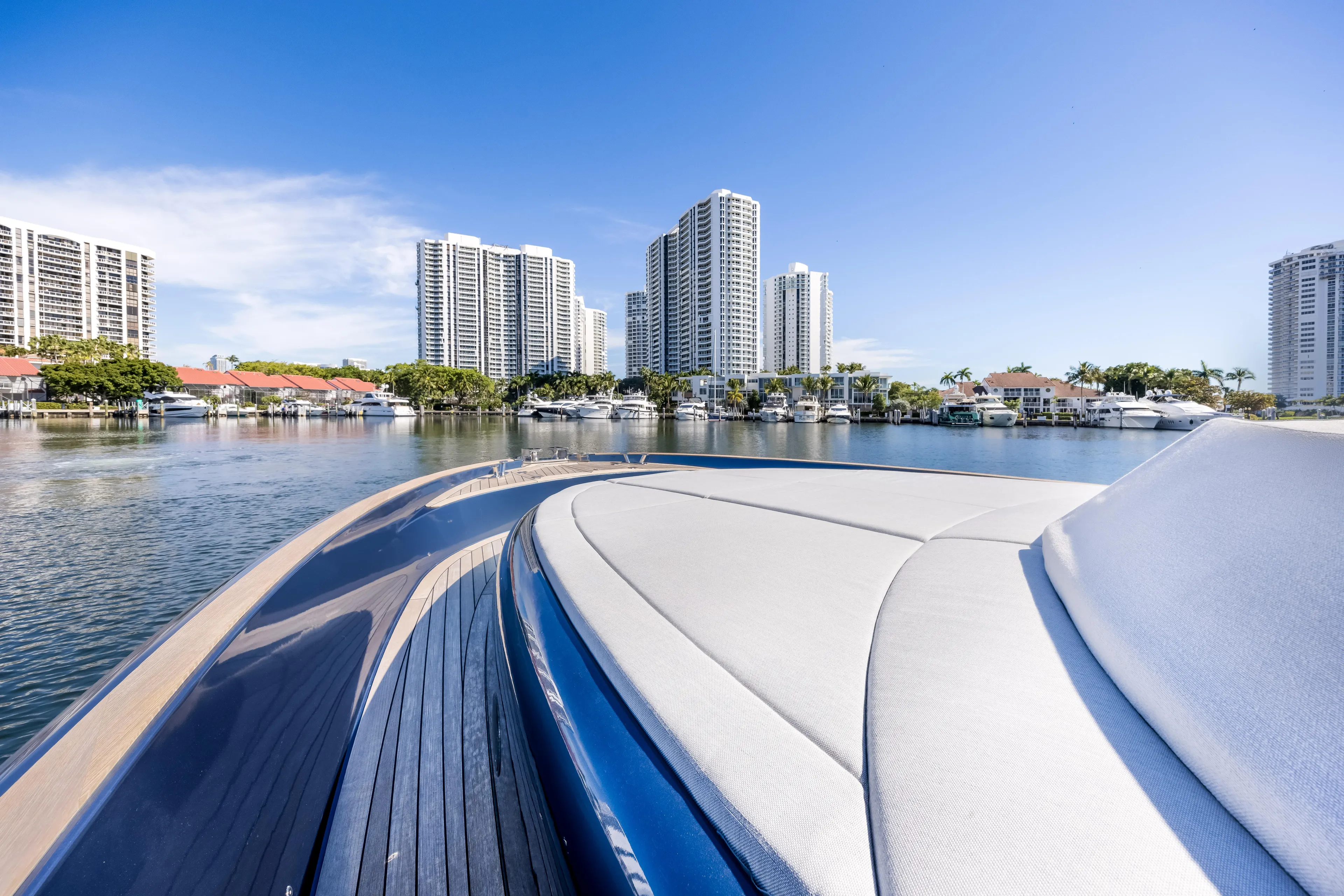 Salt Escape Yacht Photos Pics 2021 Solaris Power 48 OPEN yacht with city skyline and waterfront view.