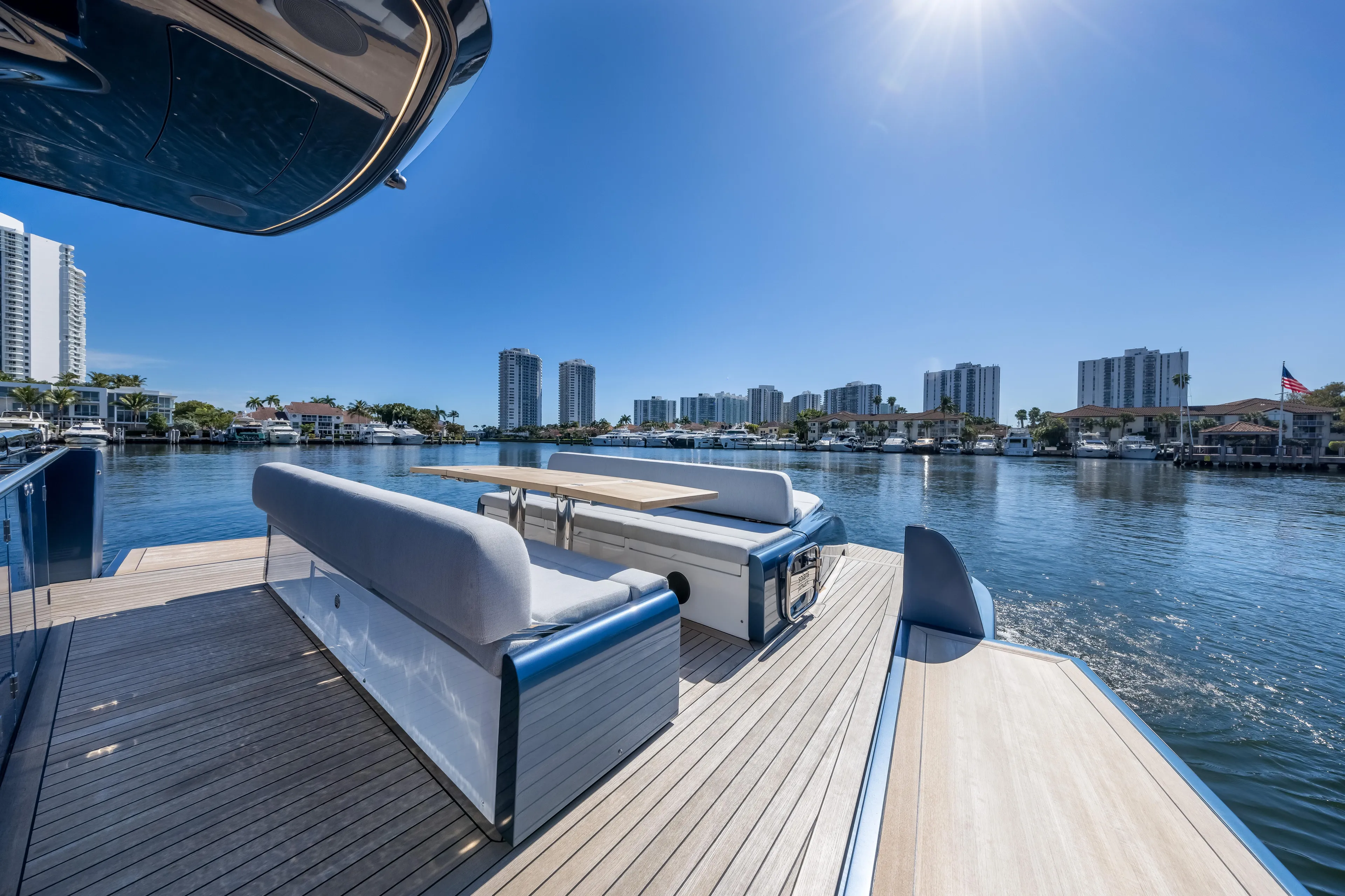 Salt Escape Yacht Photos Pics Luxurious Solaris Power 48 OPEN yacht deck with waterfront cityscape, 2021 model.