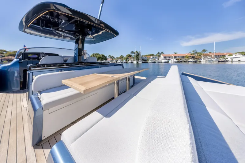 Salt Escape Yacht Photos Pics 2021 Solaris Power 48 OPEN yacht with sleek deck and luxurious seating by the water.