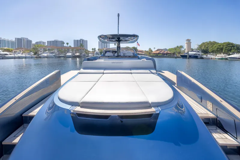 Salt Escape Yacht Photos Pics 2021 Solaris Power 48 OPEN yacht docked in a marina under clear blue skies.