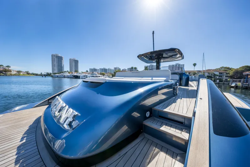 Salt Escape Yacht Photos Pics Luxurious 2021 Solaris Power 48 OPEN yacht docked under clear blue sky.
