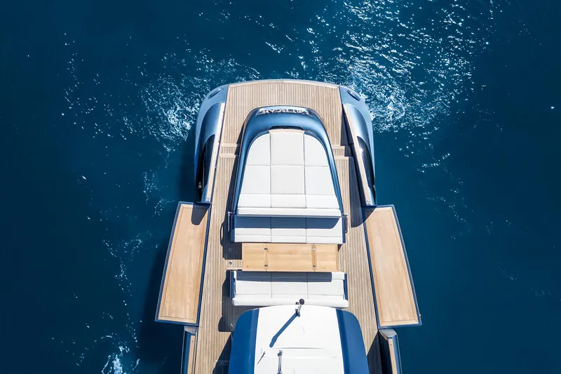 Salt Escape Yacht Photos Pics Aerial view of 2021 Solaris Power 48 OPEN yacht on blue ocean water.