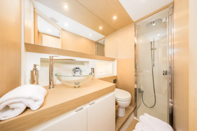 Salt Escape Yacht Photos Pics Luxurious bathroom interior of 2021 Solaris Power 48 OPEN yacht.