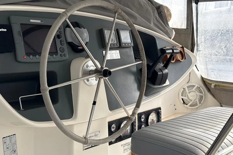  Yacht Photos Pics Steering wheel and controls of 2003 Fountaine Pajot Belize 43 catamaran.