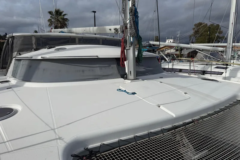  Yacht Photos Pics 2003 Fountaine Pajot Belize 43 catamaran with sleek deck and rigging, docked in marina.
