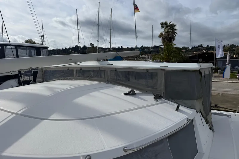  Yacht Photos Pics 2003 Fountaine Pajot Belize 43 catamaran docked, featuring sleek design and spacious deck.